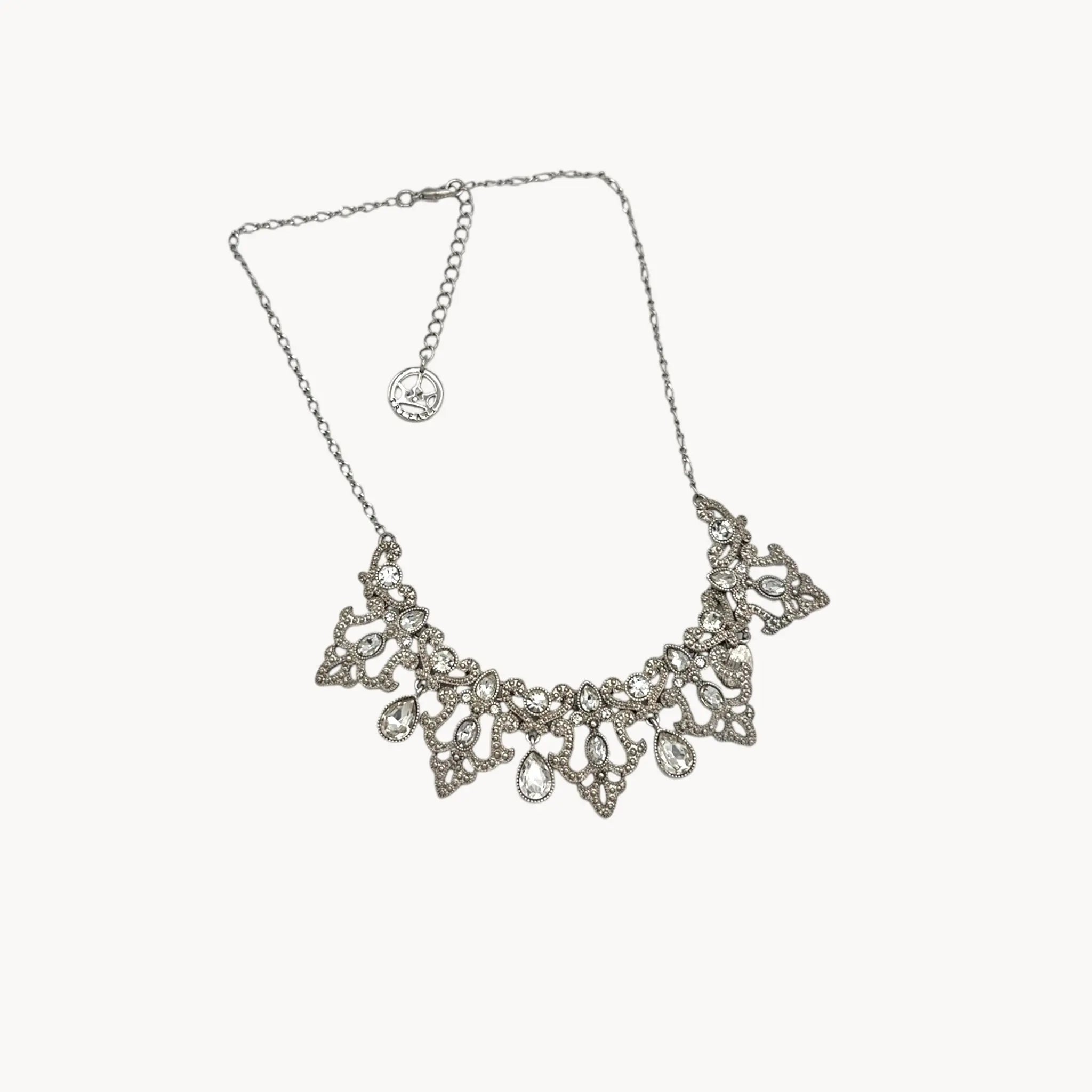 Against white background Vintage 1990s Trifari rhinestone statement necklace with teardrop accents