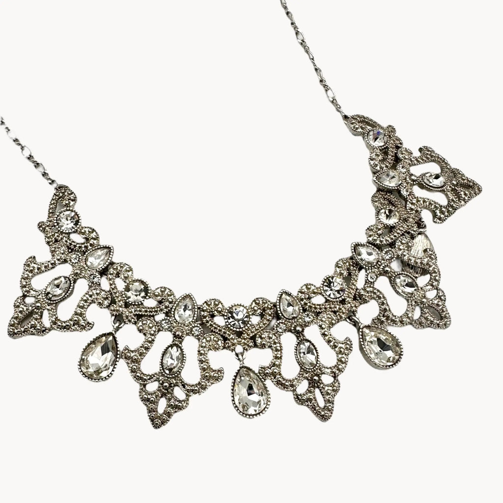 Close up view of Vintage 1990s Trifari rhinestone statement necklace with teardrop accents