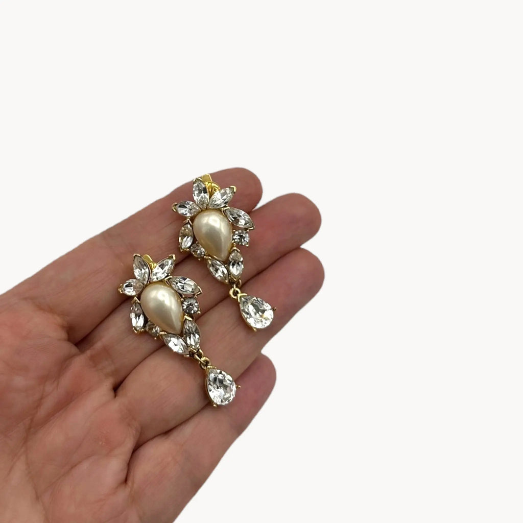 Scale size view 1990s Trifari faux pearl and crystal clip-on earrings in gold-tone with teardrop design, vintage bridal jewelry.