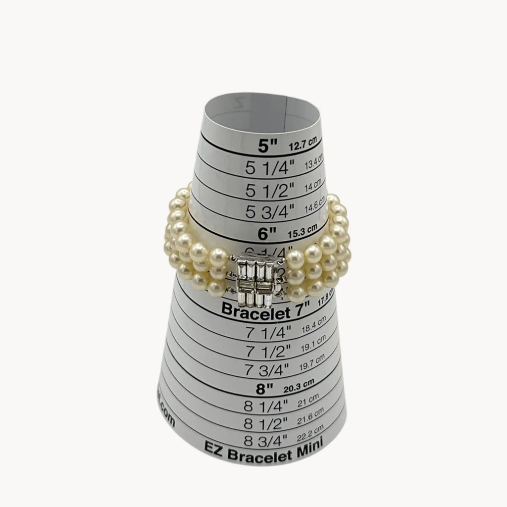 size view Vintage Trifari faux pearl triple-strand bracelet with baguette crystal clasp, 1950s–1960s bridal jewelry