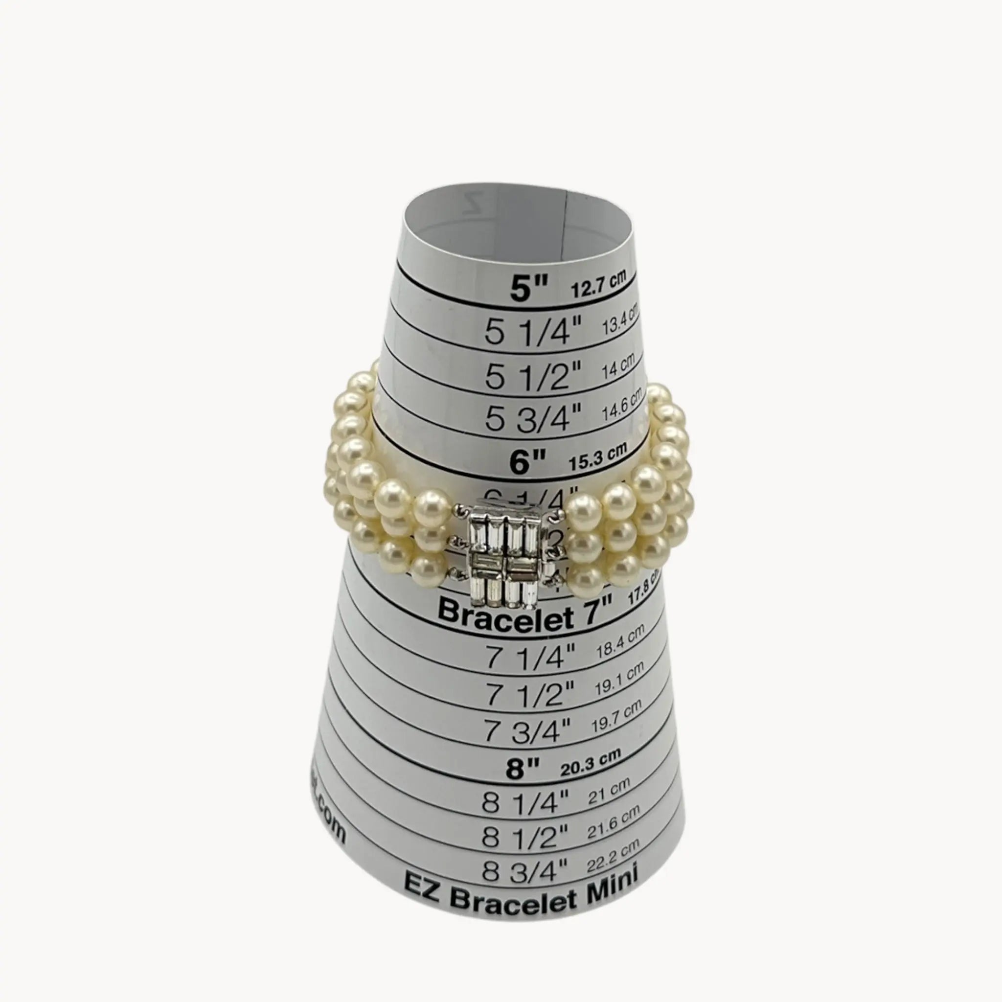 size view Vintage Trifari faux pearl triple-strand bracelet with baguette crystal clasp, 1950s–1960s bridal jewelry