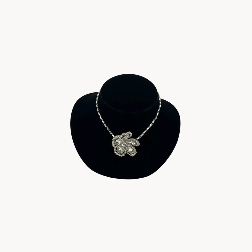 Large Trifari Rhinestone Floral Necklace on black bust.