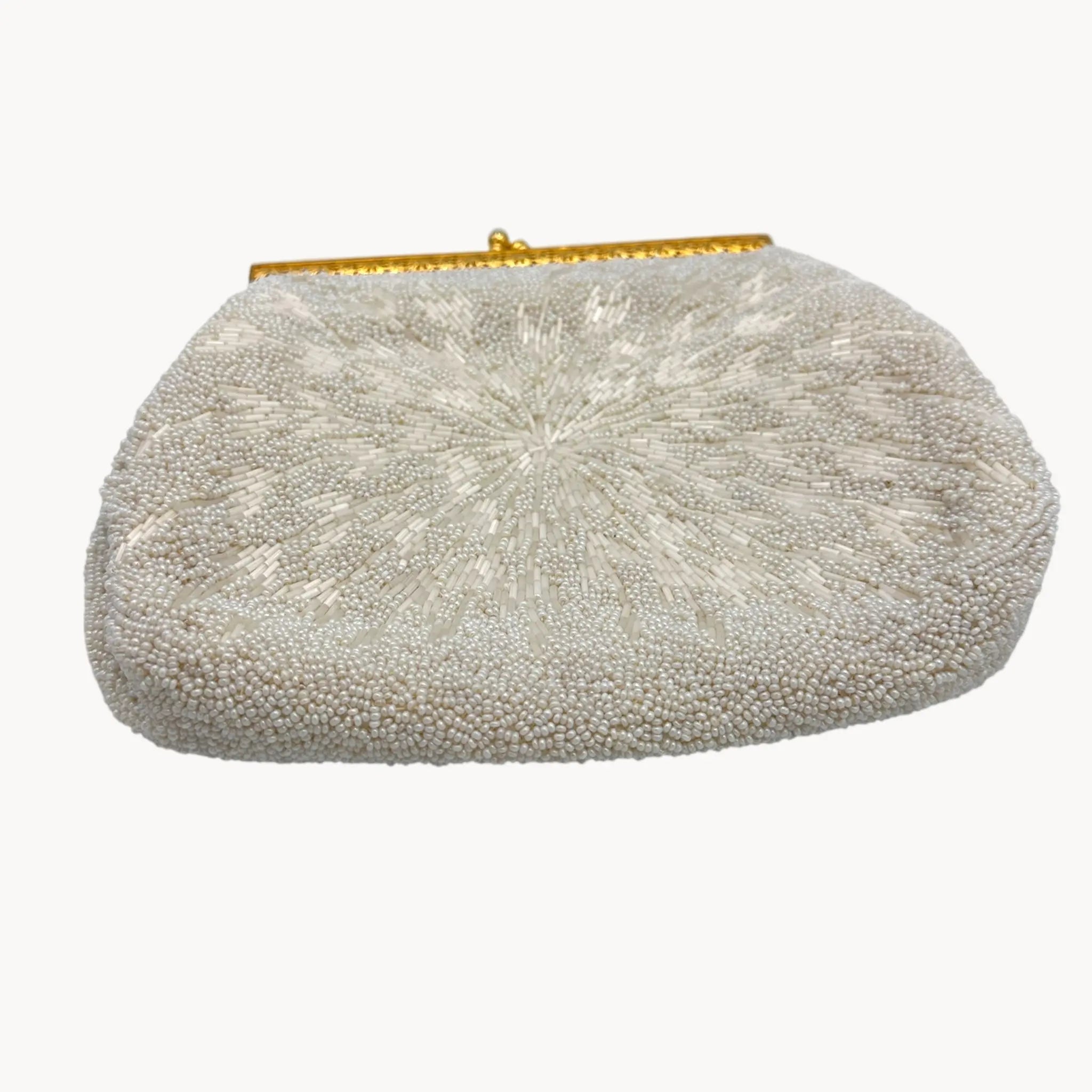 Silver beaded clutch bag with a gold clasp on a white background