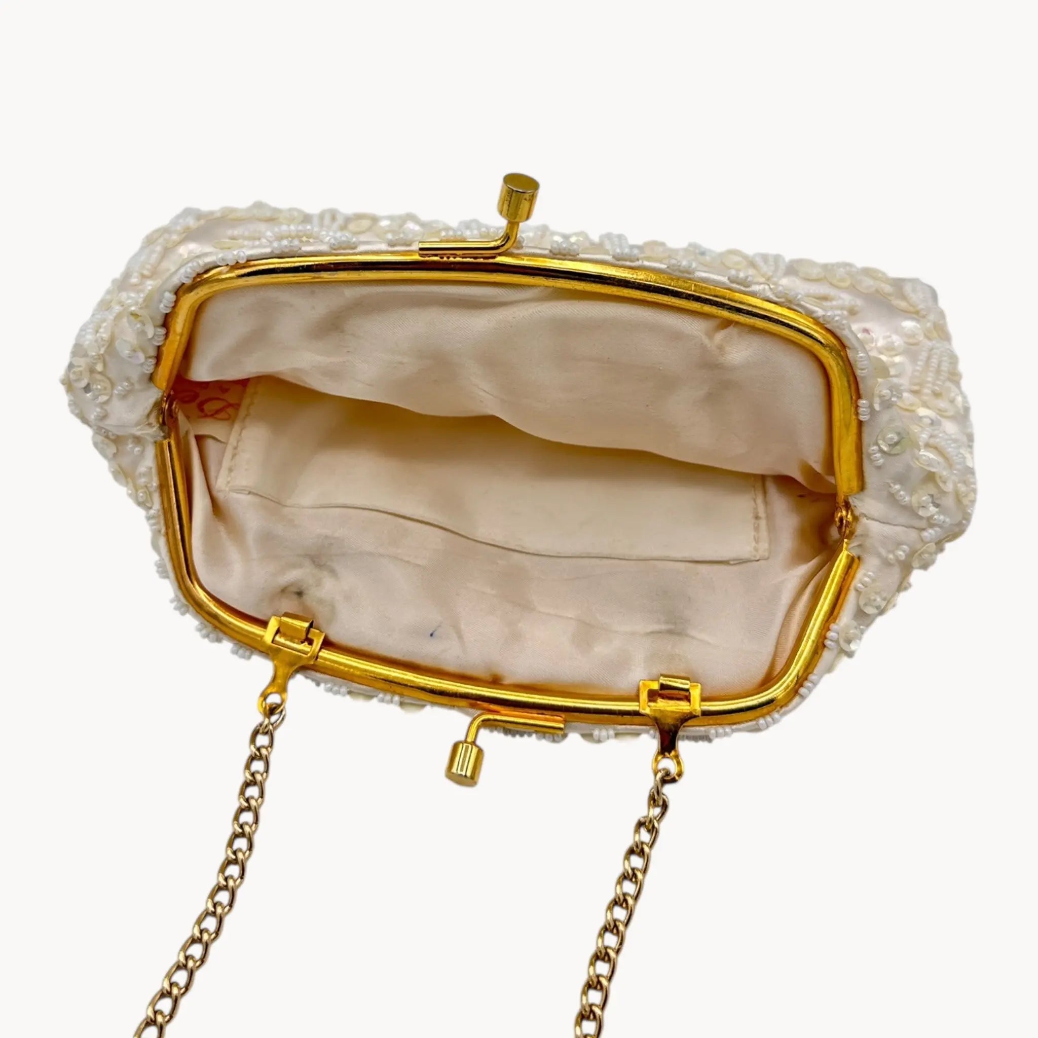 Inside view of Vintage white sequined beaded handbag with gold chain handle and kiss-lock clasp