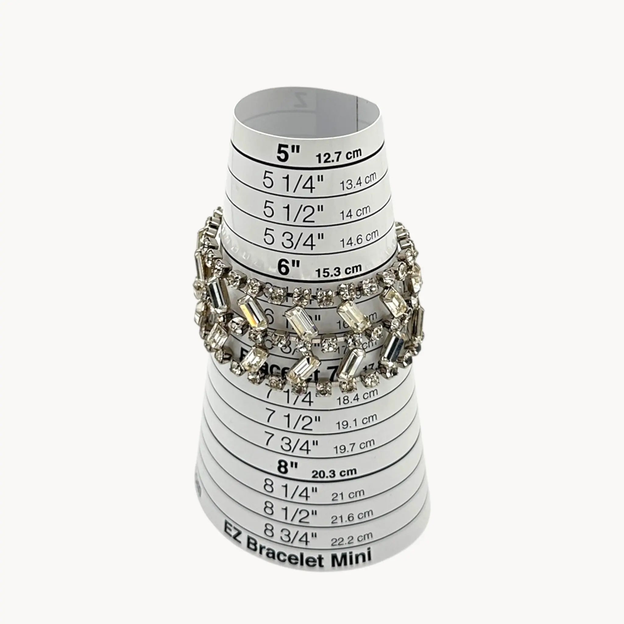 On sizer view of Vintage wide rhinestone bracelet with round and baguette-cut stones