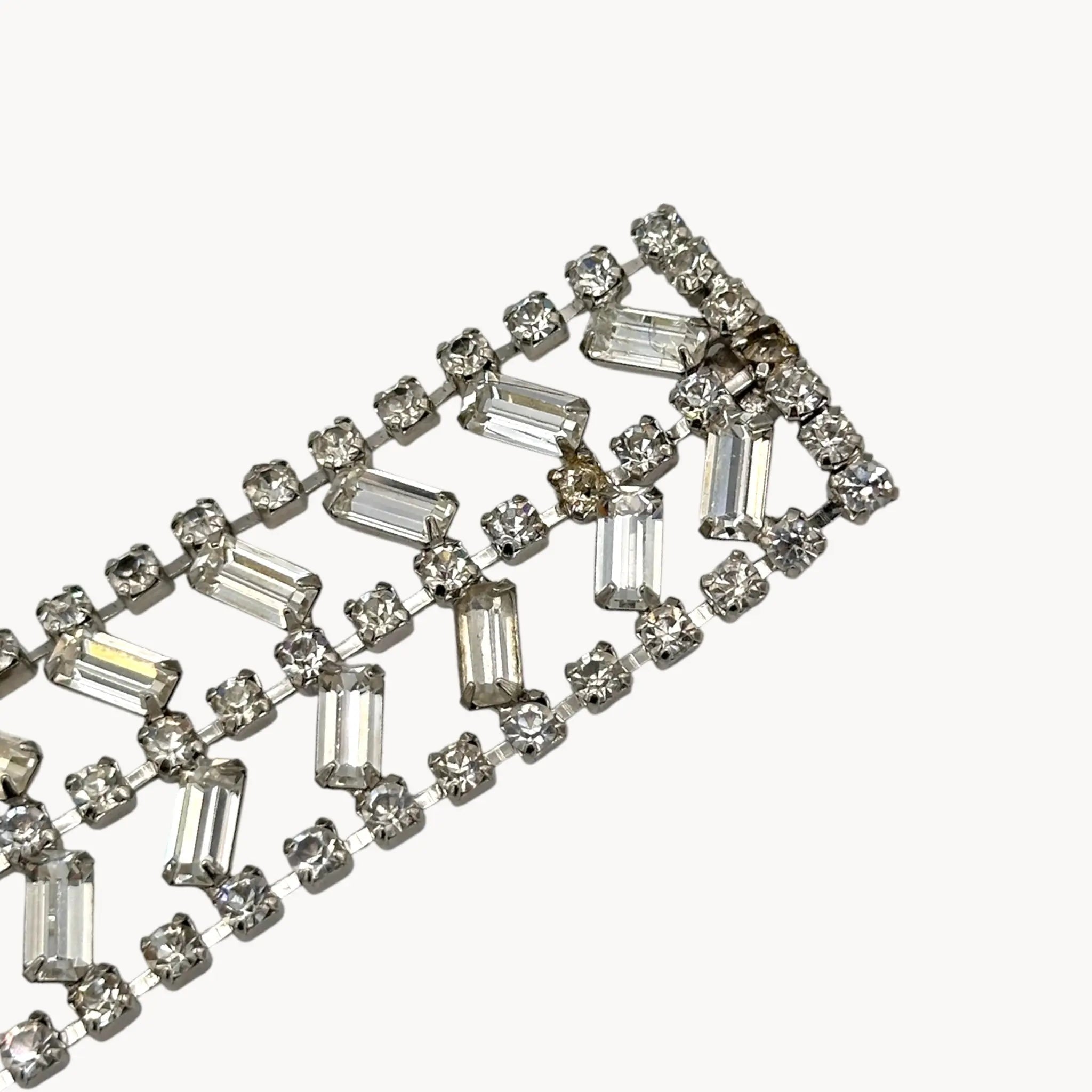 Close up view of clasp and one dark rhinestone of Vintage wide rhinestone bracelet with round and baguette-cut stones