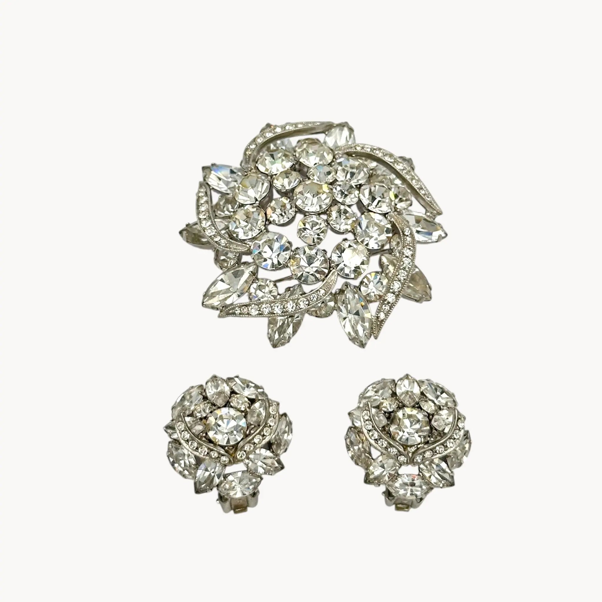 Close up view of Weiss rhinestone brooch and earring set with vintage floral design