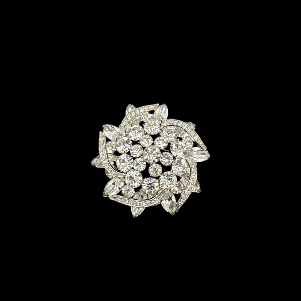 Close up of brooch on black background Weiss rhinestone brooch and earring set with vintage floral design