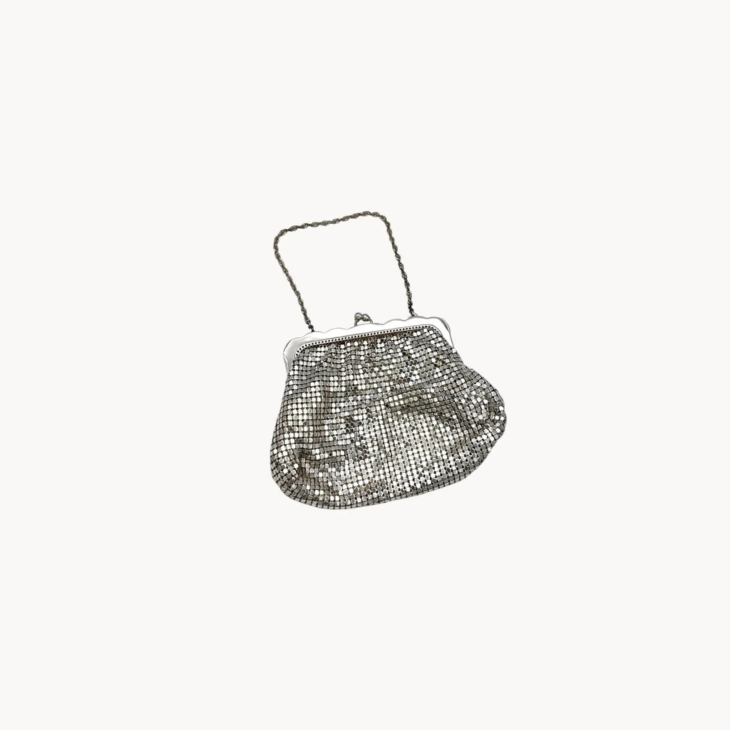Whiting & Davis silver mesh petite Art Deco style handbag with chain handle on white background.